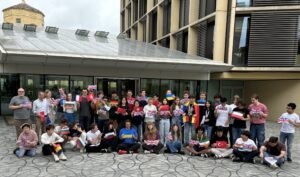 On the Penrose Paving at the Mathematical Institute, the group of 2024 participants proudly display the flags of their home countries.